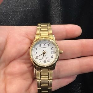 Casio Gold Timepiece with White Face